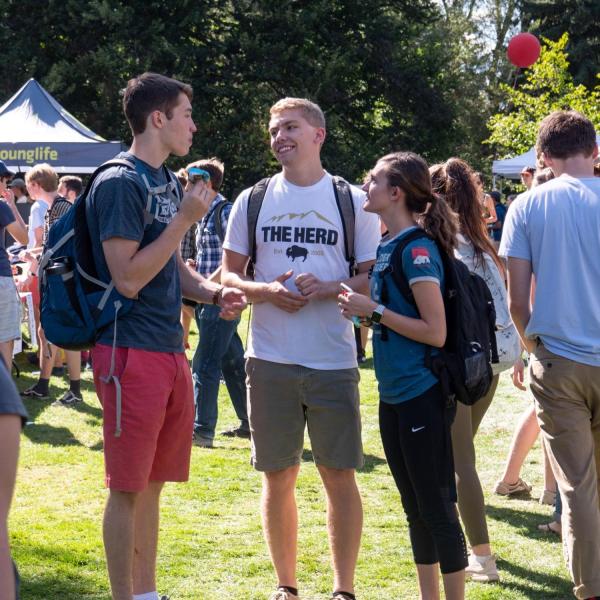 Students chat at the Be Involved Fair