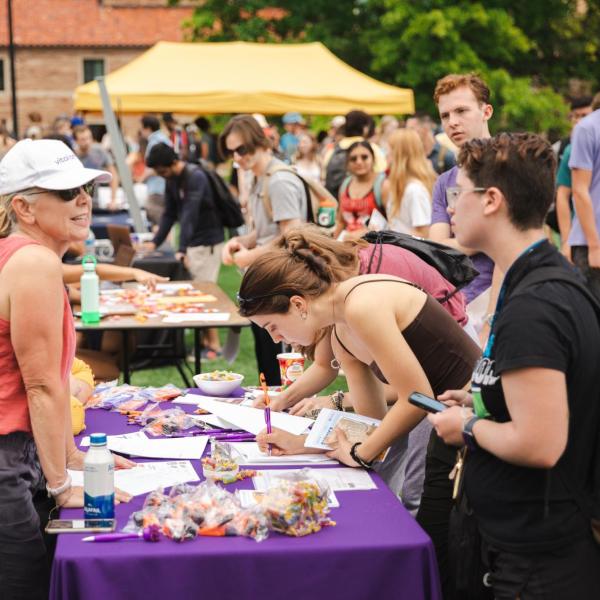 Students visiting booths at the fall Be Involved Fair