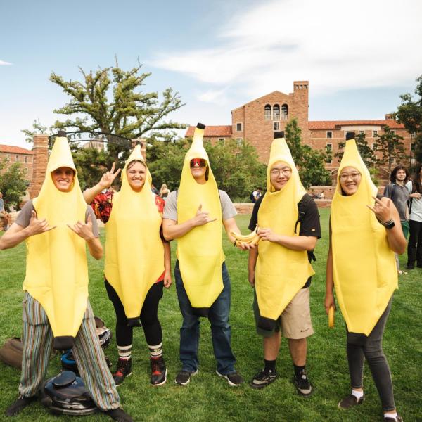 Students in banana costumes at the Be Involved Fair on campus