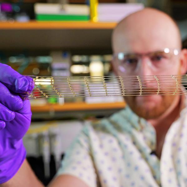 A researcher stretches a material made for 3D printing