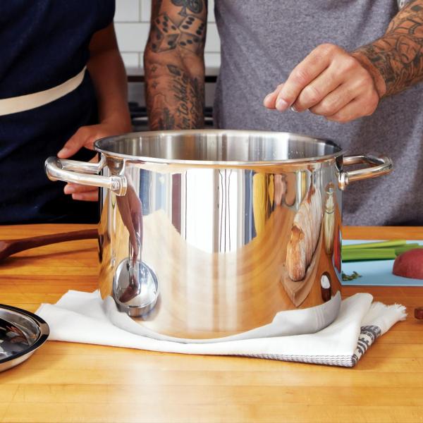 two people cooking in a kitchen