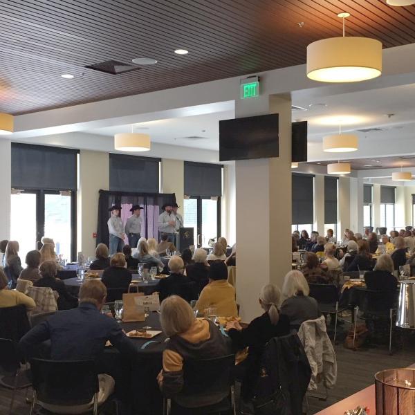 Four Ralphie handlers speak at a Buffalo Belles luncheon