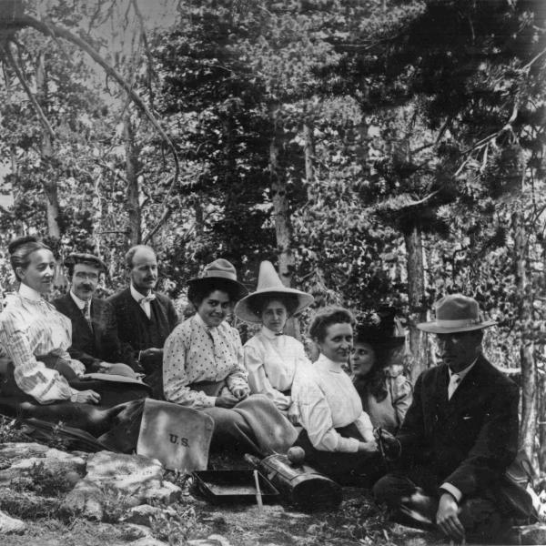 Dr. Francis Ramaley and Dr. Caldwell (right) with a class in the forest near the Mountain Research Station in 1909. Students are wearing formal field dress.