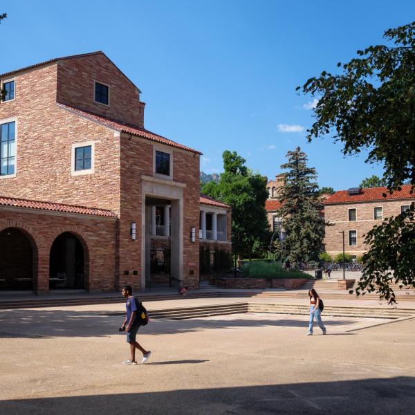 Students walk past the UMC on campus
