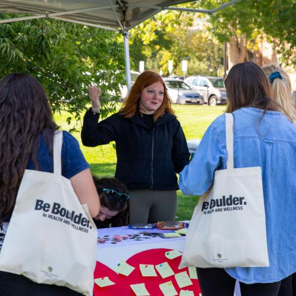 CAPS booth at a health and wellness fair on campus