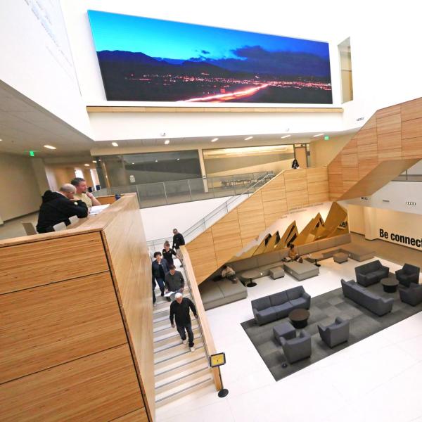 Campus community members walking up a staircase in the CASE building