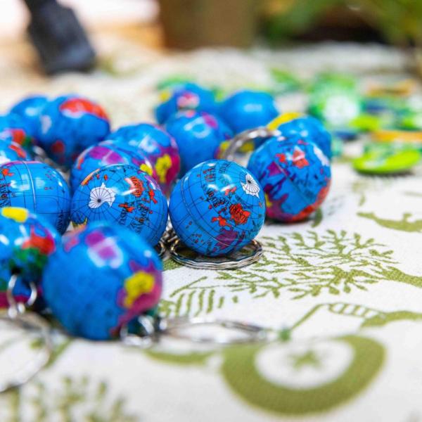 Tiny globe keychains on a table