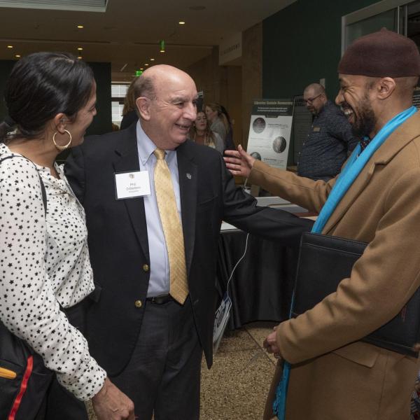 Chancellor Philip DiStefano greets Violeta Chapin (left, Clinical professor of law and co-director of clinical programs and Reiland Rabaka, Professor of African, African American and Caribbean Studies and founding director of the Center for African and African American Studies to the 2023 Chancellor&rsquo;s Summit for the University of Colorado Boulder. (Photo by Casey A. Cass/University of Colorado)