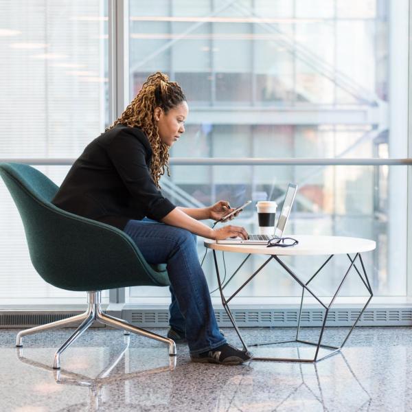Black woman working on a laptop