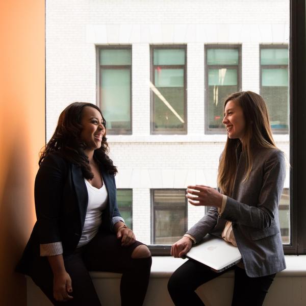 Two young professionals talking