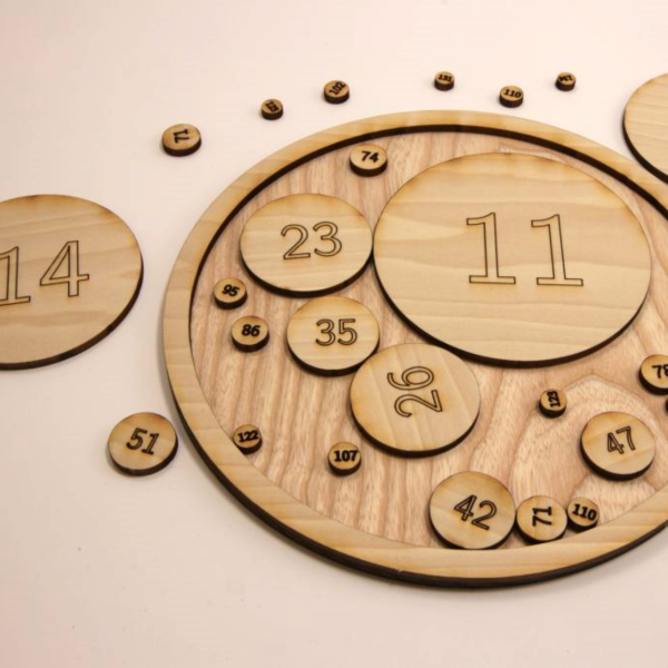 an Apollonian circle packing puzzle laser cut from wood