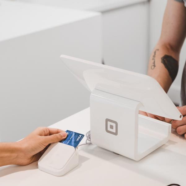 Two people at a point-of-sale system. (Clay Banks/Unsplash)