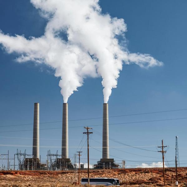 Manufacturing equipment emitting billow of smoke.