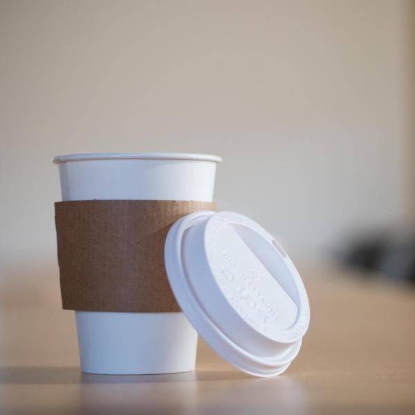 Disposable coffee cup in a board room