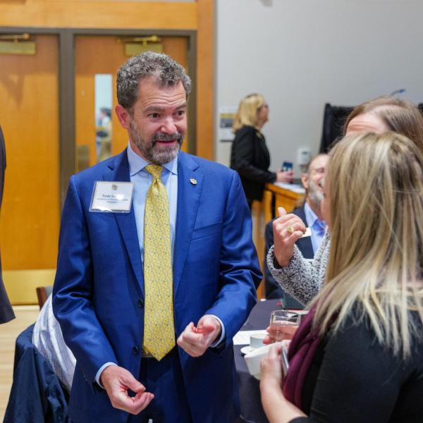 CU President Todd Saliman speaks with leaders at a quantum workforce development event