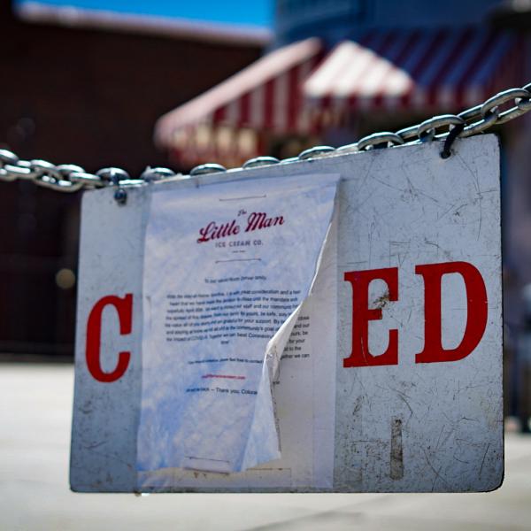 A sign announces the closure of an ice cream shop in Denver at the height of the coronavirus pandemic.