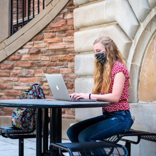 student studying on campus