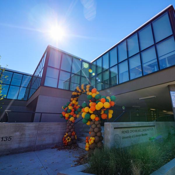 Crown Institute building exterior with balloon arch