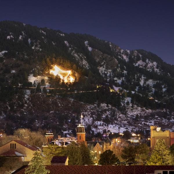 The Boulder star light on the foothills beyond the CU Boulder campus