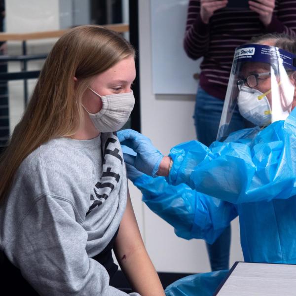 CU Boulder student Olivia Parsons getting a COVID-19 shot