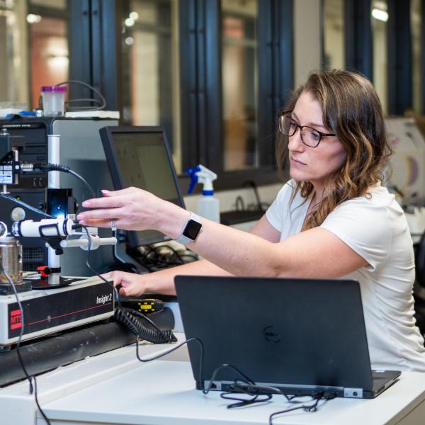 Kristine Fischenich working on lab equipment