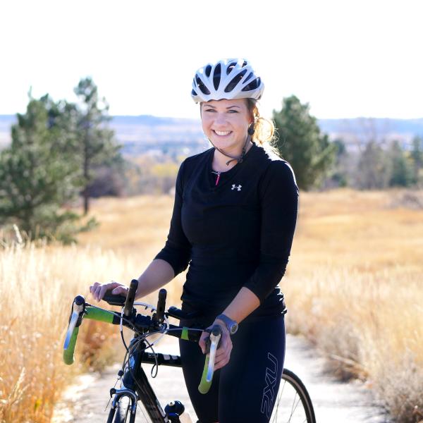 Laura Knoblach poses with her bicycle