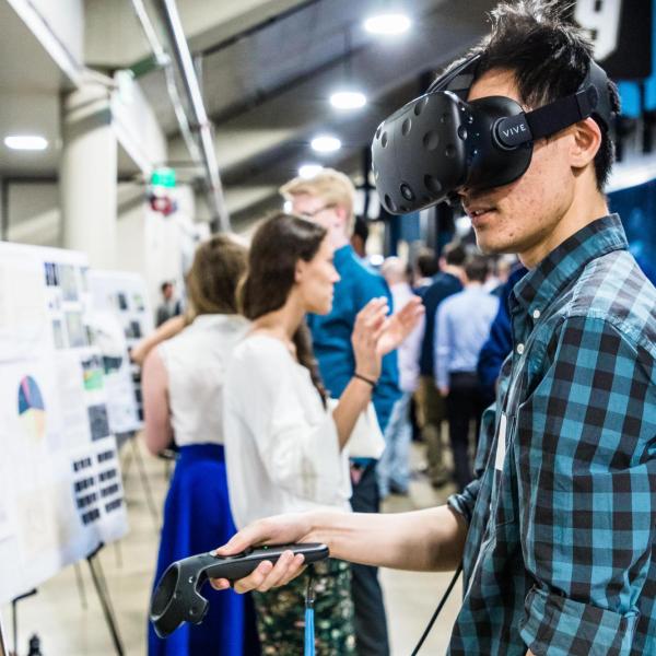 Person using VR headset at CU Engineering Projects Expo