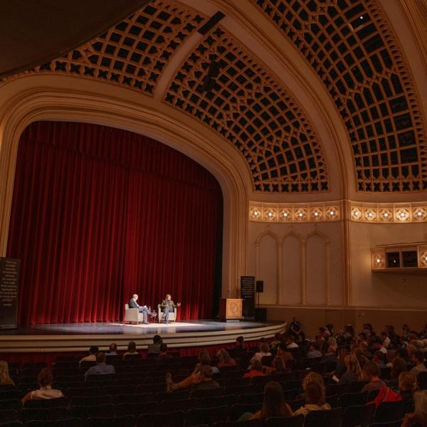 Person speaking in Macky Auditorium