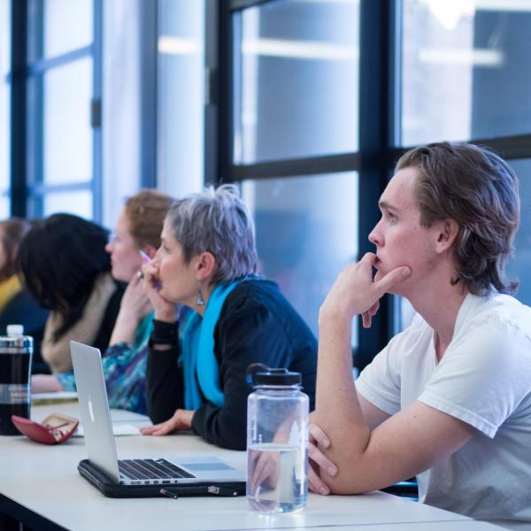 Campus community members listen to a speaker in UMC 247