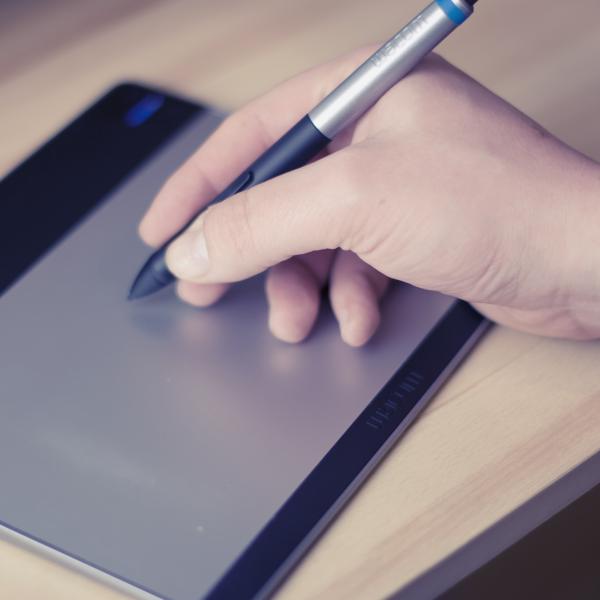 Man gives electronic signature with digital stylus