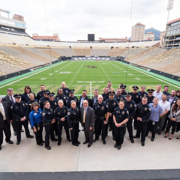 CU Police department gather at Folsom Field for a goup photo during the swearing-in ceremony for new CU Boulder Police Chief Doreen Jokerst in 2018. (Photo by Glenn Asakawa/University of Colorado)
