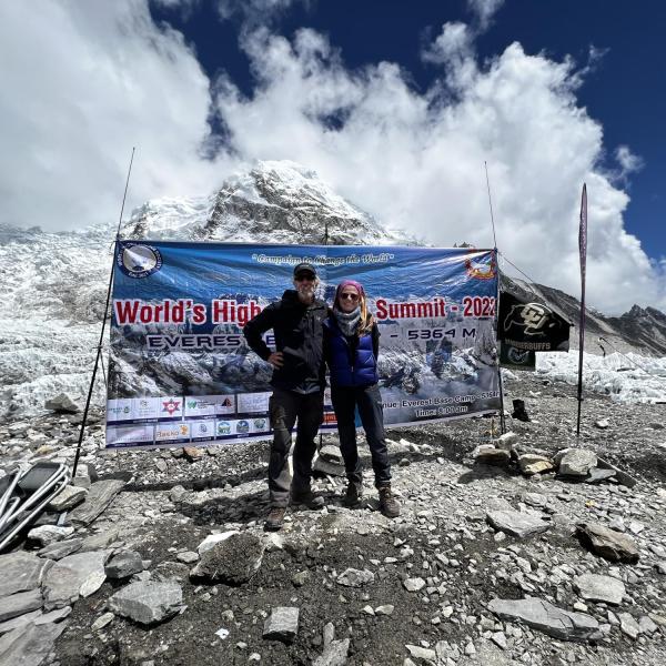 Researchers with CU Boulder and CSU signs at the Everest base camp