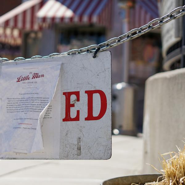 A closed sign in front of Little Man Ice Cream in Denver, CO.