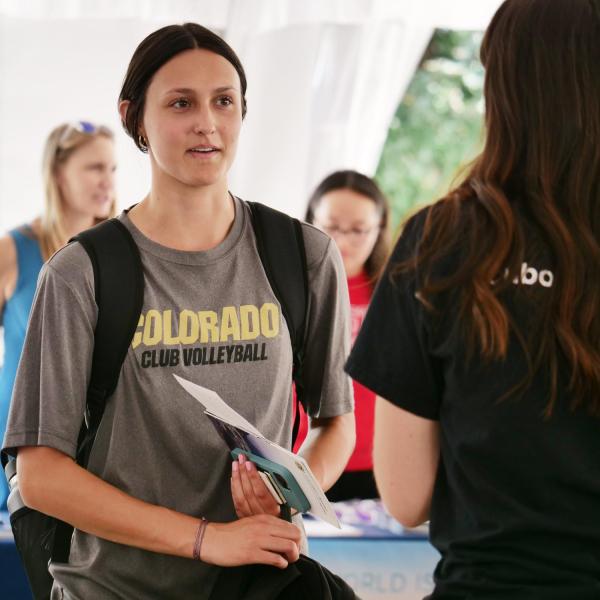 Campus community members attend an outdoor event on campus