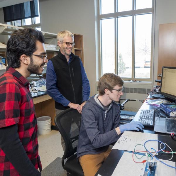 Professor Mike McGehee and students working in the lab. (Photo provided)