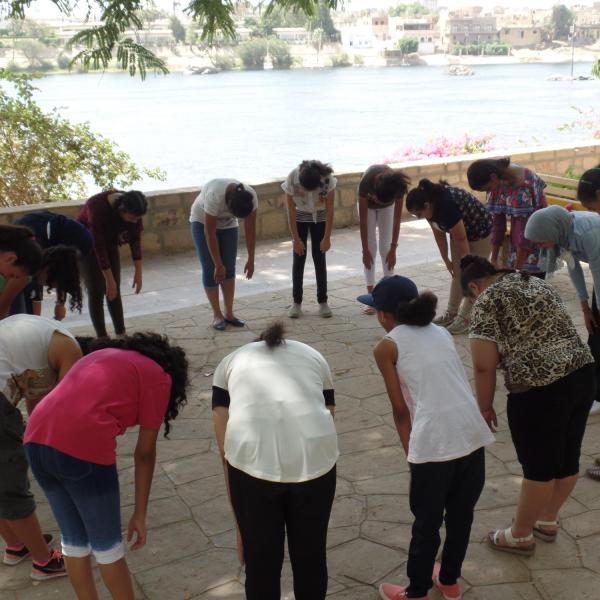 Participants engaging in vocal empowerment exercises
