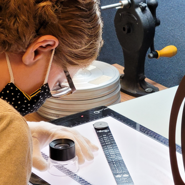 A person working on film preservation