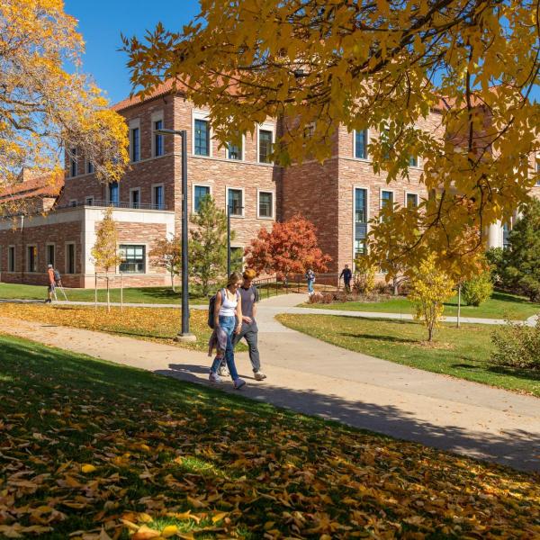 Students walking on campus during fall