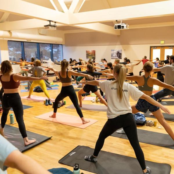 students participating in a yoga class