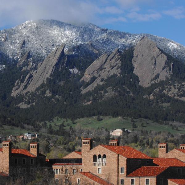 Looking over the roofs of Farrand Hall toward the Flatirons