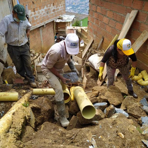 Local residents build a stairway in Medellín, Colombia