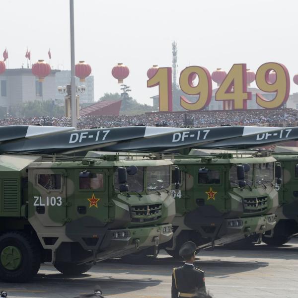 Military vehicles carry an earlier version of China’s hypersonic missile during a 2019 parade