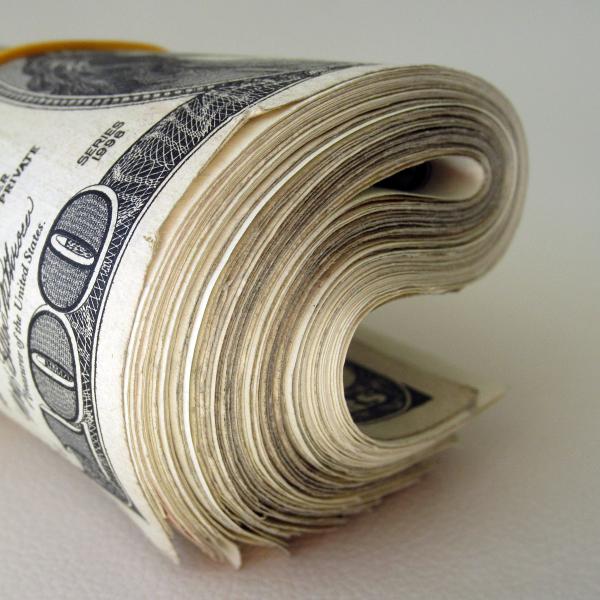 Roll of cash | Photo by 401kcalculator.org