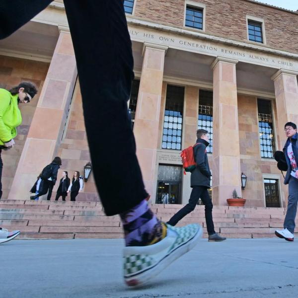 Students and campus community members walking outside of Norlin Library