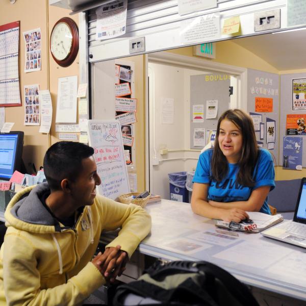 CU Boulder employee engages with student