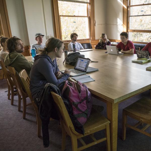 Students sit in a small class discussion