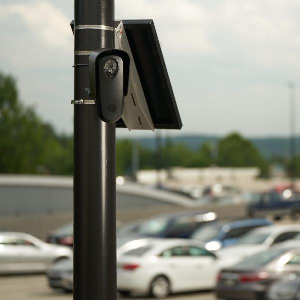 A Flock Safety camera in a parking lot