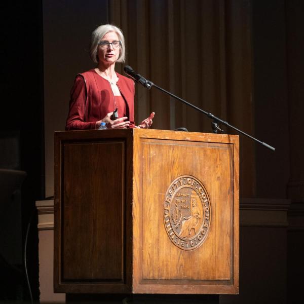 Jennifer Doudna stands on stage at a podium