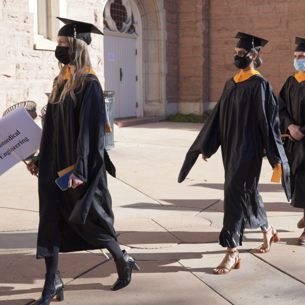 Biomedical engineering graduates walk in procession