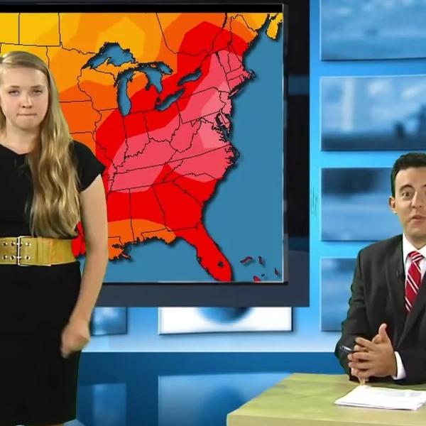 Two students in front of tv screen.
